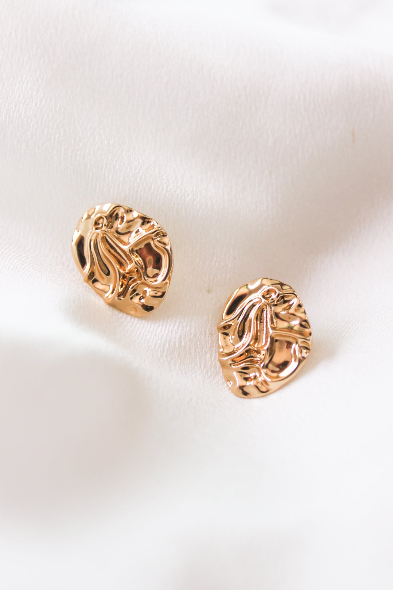 Aretes moneda